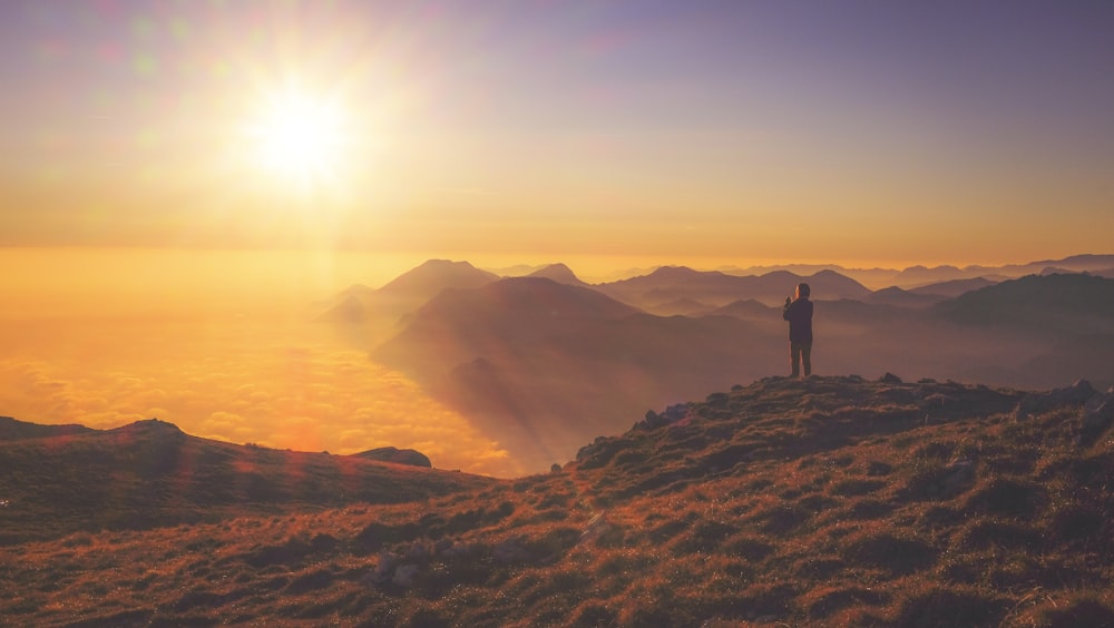 person standing on mountain