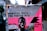 A weathered poster on a street cabinet featuring a person with a serious expression. The poster includes text promoting a music event, 'Monster Truck + The Footprints,' along with the venue name 'SOPHIEN SÆLE.' The image possesses a gritty, urban feel with a mix of vibrant and muted colors.