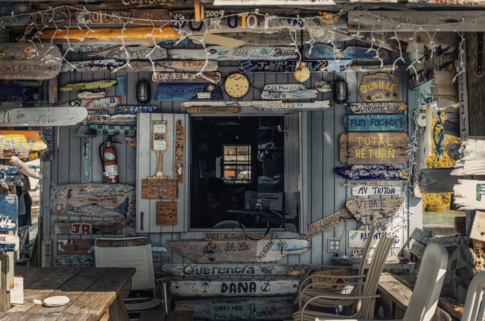 wooden house with assorted signage