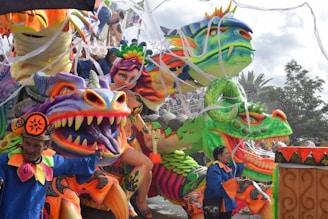 A towering, intricate parade float bursting with vibrant colors and detailed craftsmanship.
