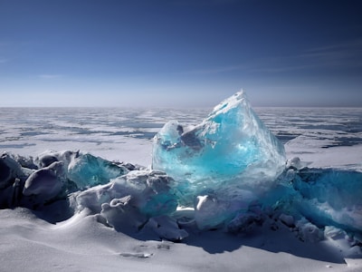 The vast Columbia Icefield with its icy expanse under a bright blue sky.