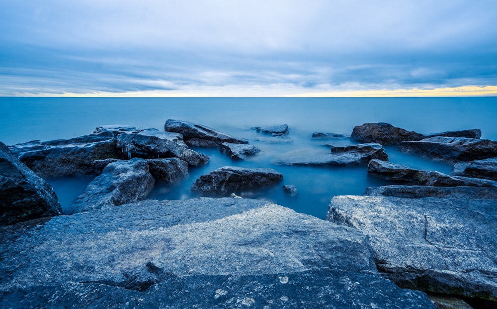 rocks and body of water during daytime