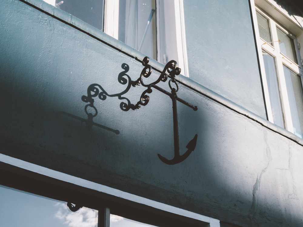 black anchor mounted on wall