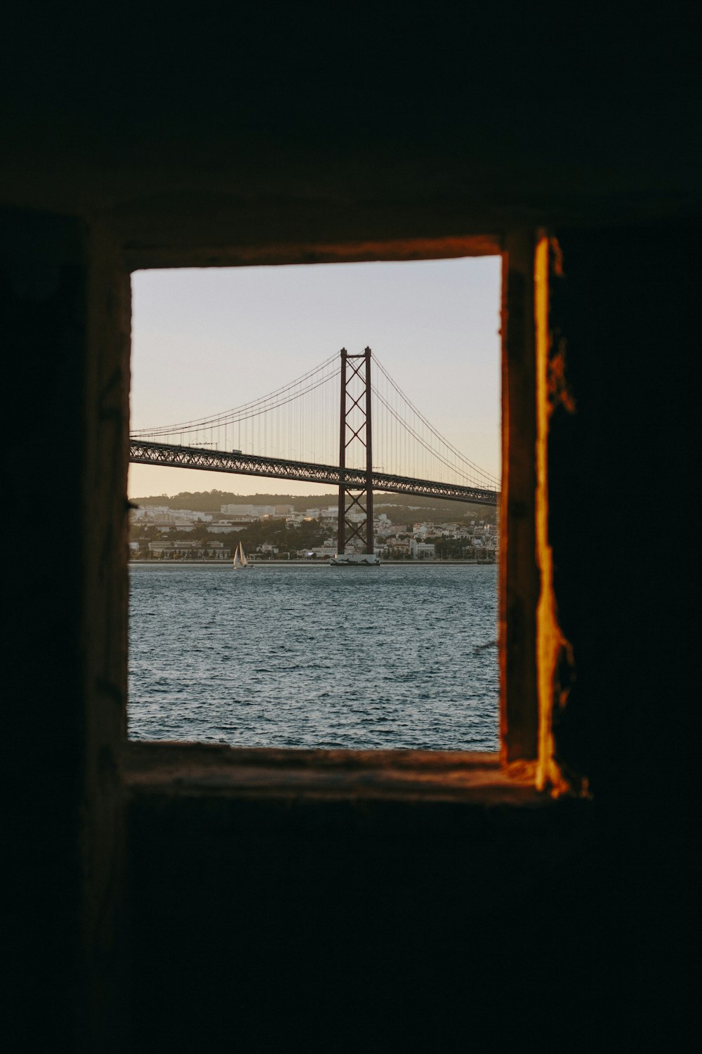 window with view of San Francisco bridge