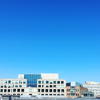 Modern urban buildings under a clear sky.