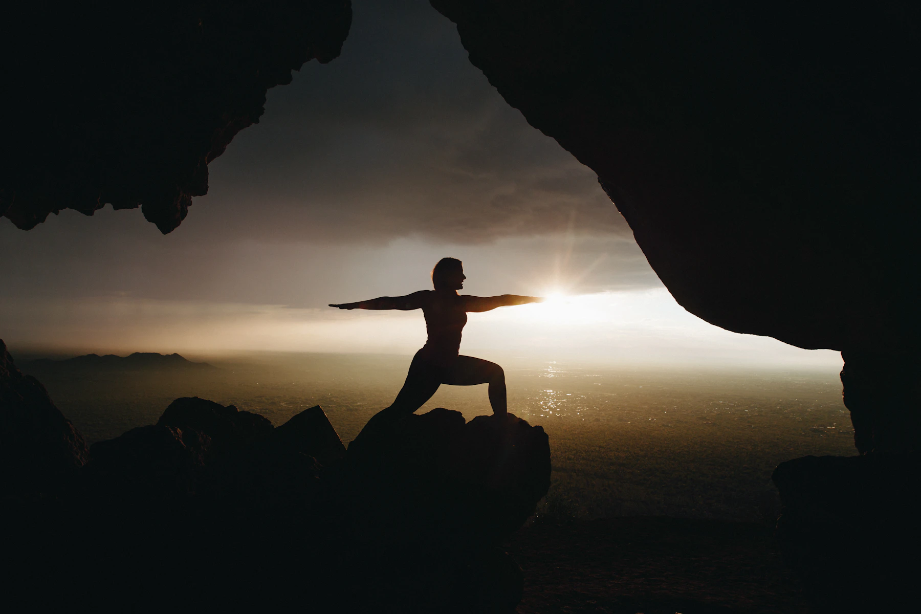 Silhouette of yoga pose during sunset
