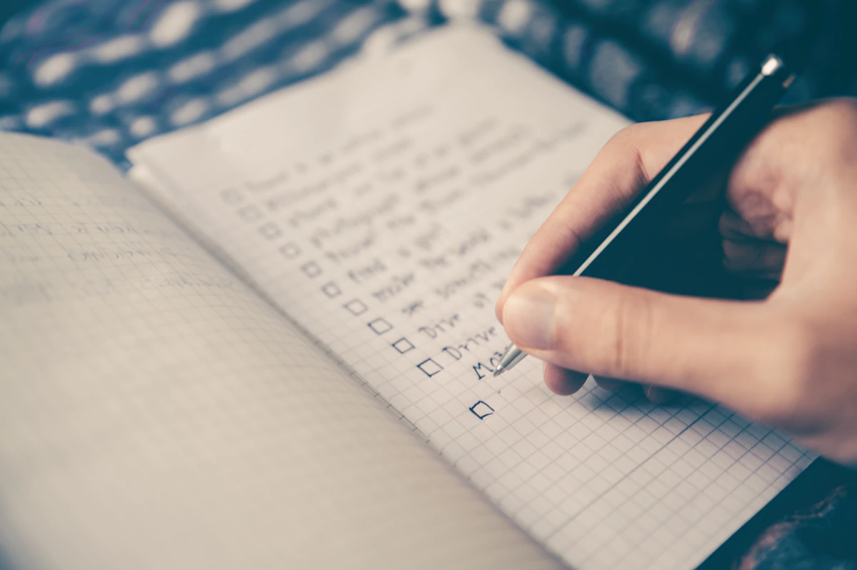 An open notebook and pen on a work desk