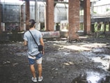 man standing in front of building