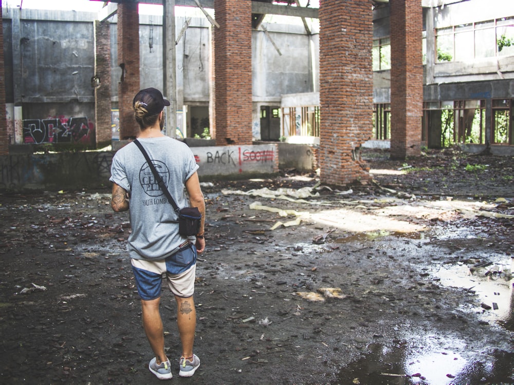 man standing in front of building