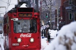 red Coca-Cola tram during snow