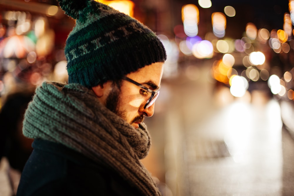 man looking down on side on the street