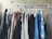 A happy customer using a Sanwall clothes rack in her home.