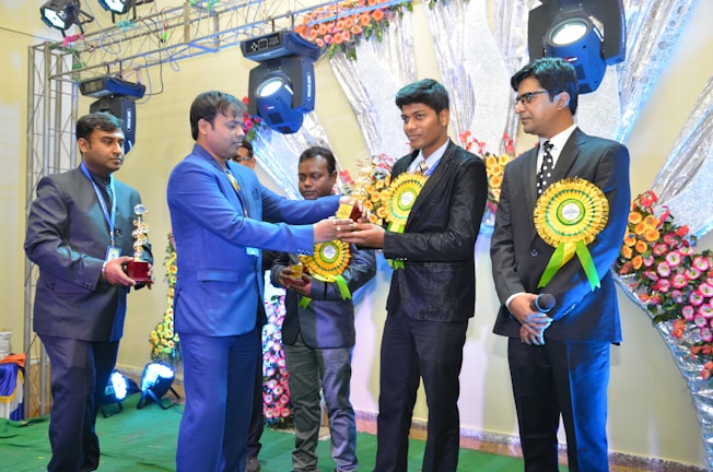 An award ceremony at IIT Bombay with students and judges.