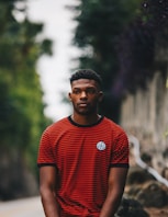 man wearing red and black striped ringer shirt