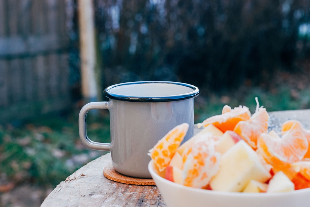 grey mug on brown wooden table