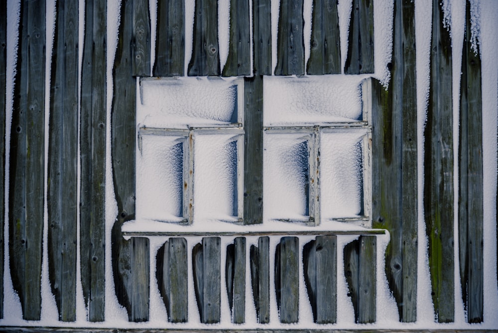 two white wooden framed 3-pane window freezed during daytime