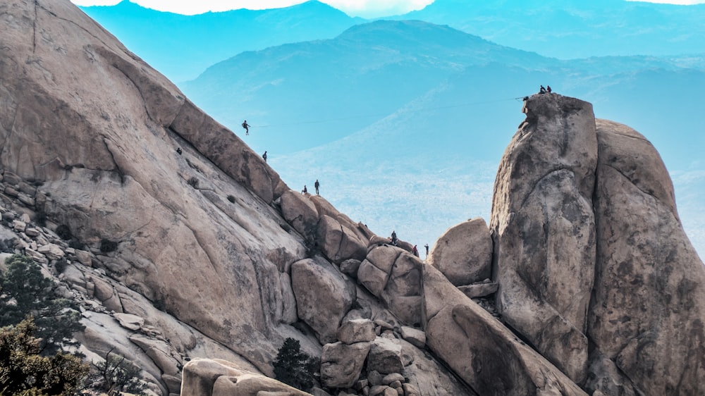 people climbing on mountain