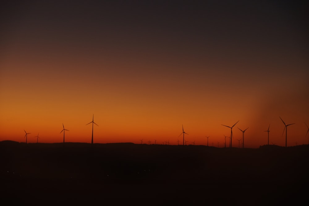 silhouette photography of wind mills