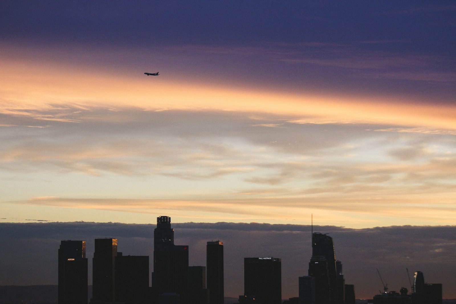 Canon EOS 7D + Canon EF 75-300mm f/4-5.6 USM sample photo. Plane flying over silhouette photography