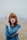 woman in blue raglan shirt shallow focus photography