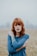 woman in blue raglan shirt shallow focus photography