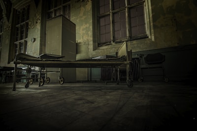 hospital bed on concrete pavement