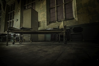 hospital bed on concrete pavement