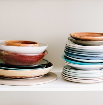 assorted-color ceramic plates and saucers