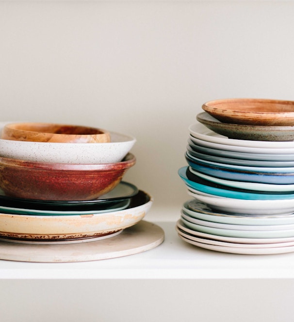 assorted-color ceramic plates and saucers