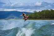man playing wakeboard during daytime