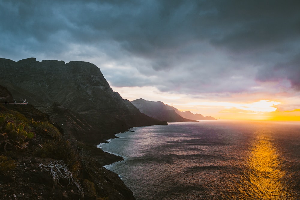 body of water near mountains