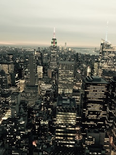 Aerial view of the Ferrara Manufacturing building in New York City with city skyline in the background.