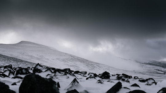 snow covered mountain under gray clouds at daytime in Brecon United Kingdom