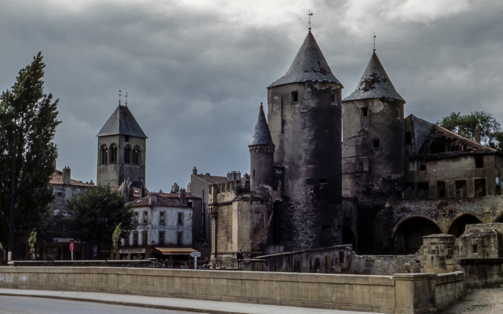 photo of gray an brown structure during cloudy day