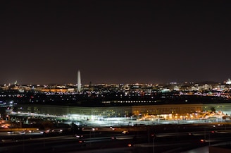 A vibrant cityscape of Washington, D.C. blending with symbols of international cooperation and economic development.