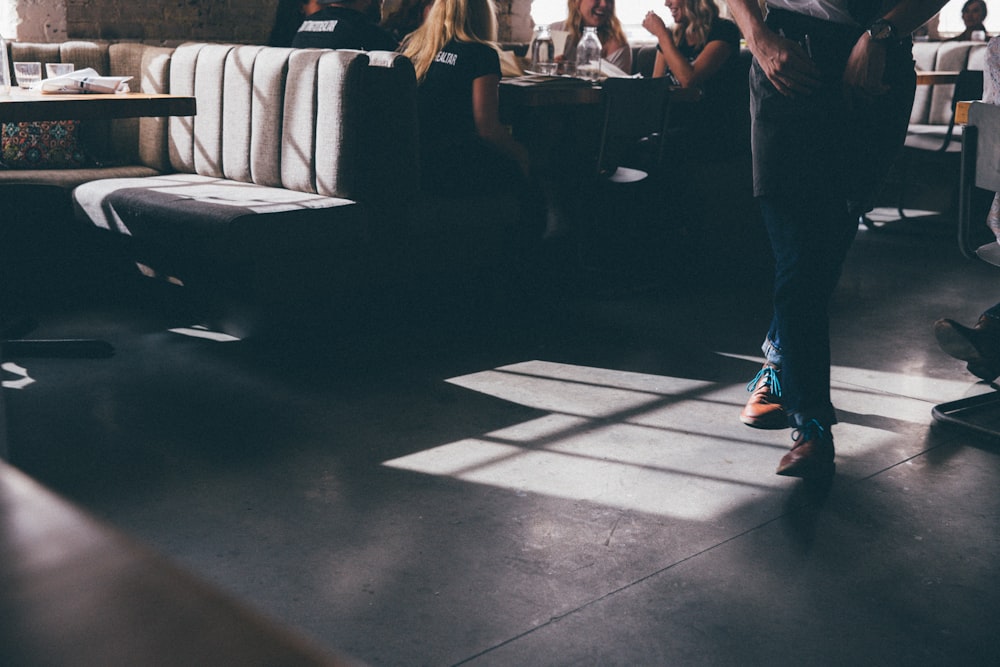 person in pair of brown shoes indoor