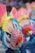 Colorful and extravagant costumes with intricate designs featuring large headdresses adorned with vibrant feathers and beads. The scene is lively and festive, showcasing cultural celebration and artistic craftsmanship.