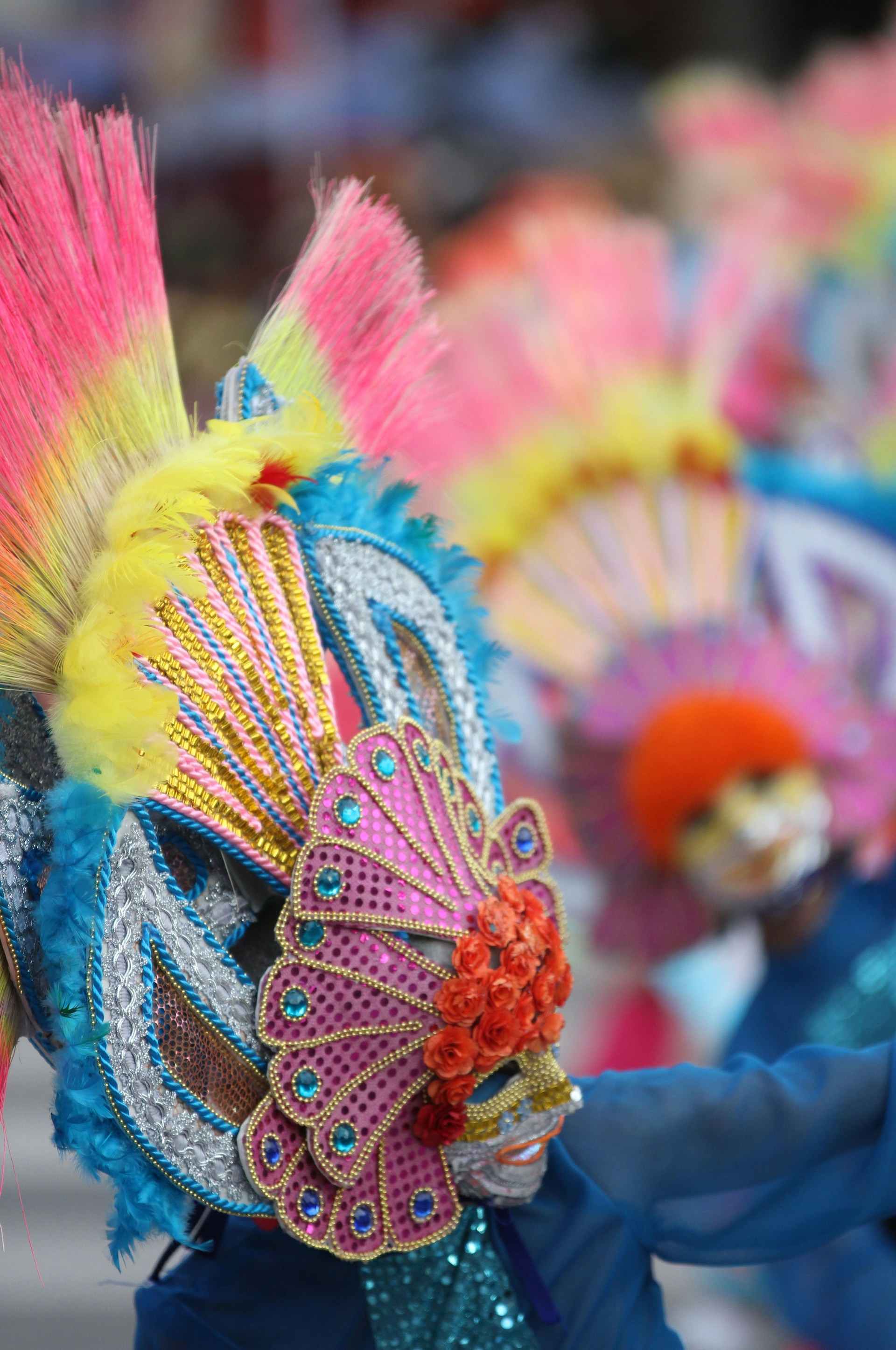 A close-up of the exclusive abadá worn by participants, adorned with bright colors and intricate designs, symbolizing the spirit of the carnival.