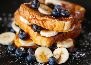 toast bread with blueberry on black plate