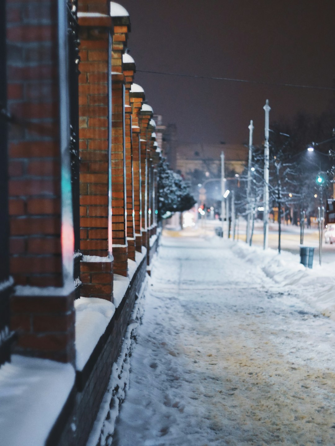 brown brick building covered with snow during daytime