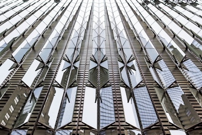 Modern building facade with reflective safety glass panels installed.