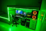 An inviting gaming setup with biggsnexor’s chair and desk accessories illuminated by ambient LED lights.