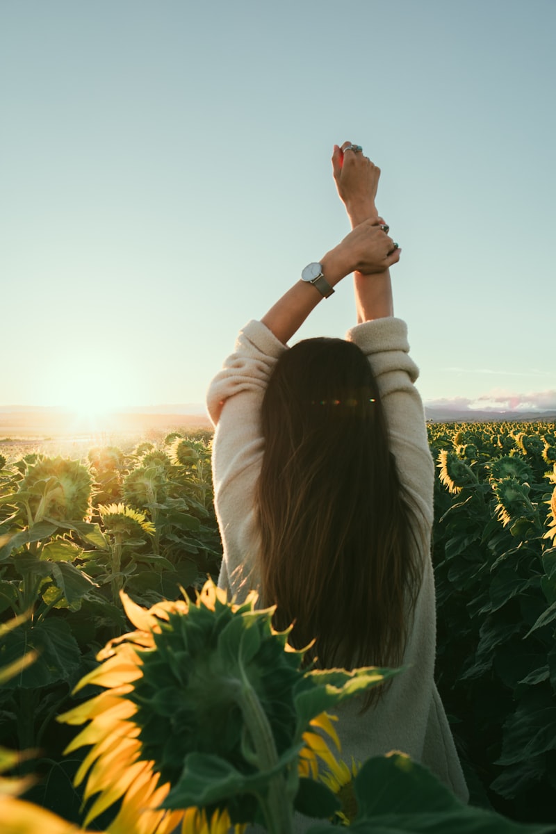 happywoman in a sunflower farm