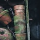 brown-and-green moss covered stacked clay pots