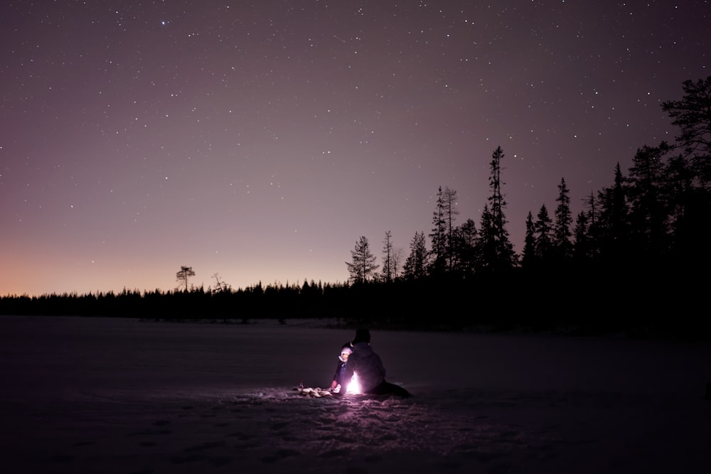 person in front of bon fire during night