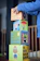 Smiling child playing with colorful building blocks from Juguetiva.