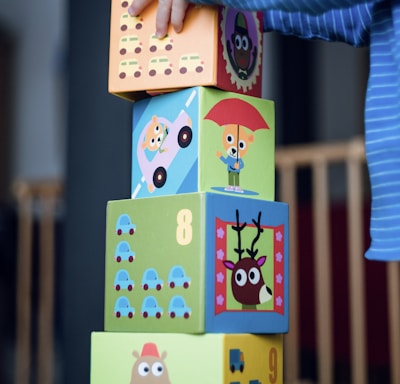 child building an four boxes