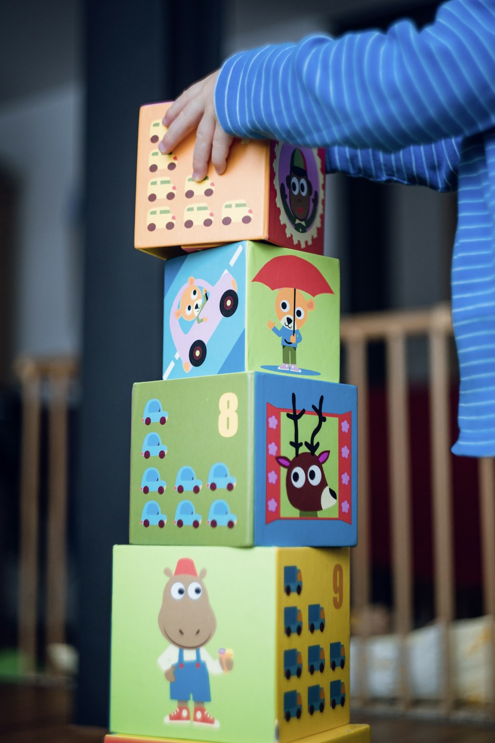 child building an four boxes