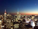 City skyline at dusk symbolizing international reach and connectivity.