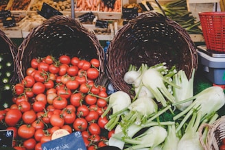 Baskets filled with vibrant organic fruits and vegetables displayed at a sunny farm market.
